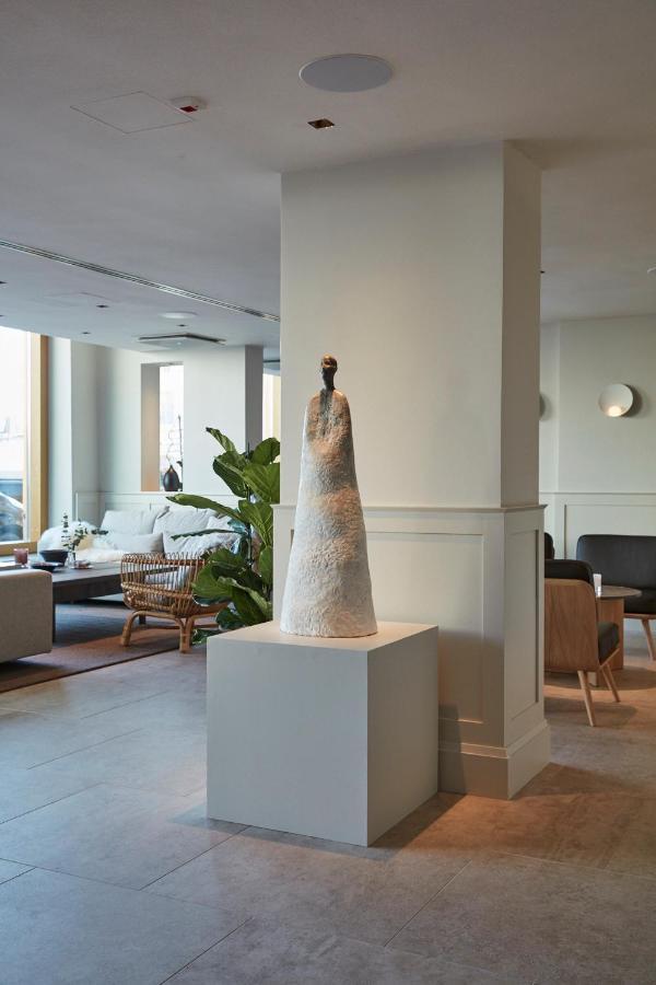 Runo Hotel Porvoo Exterior photo The sculpture "The Guardian" by artist and sculptor, Jean-Pierre Hublot, at the entrance of the hotel